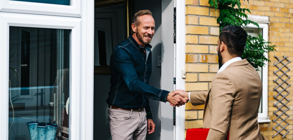 Man shaking hand with a Belvoir agent