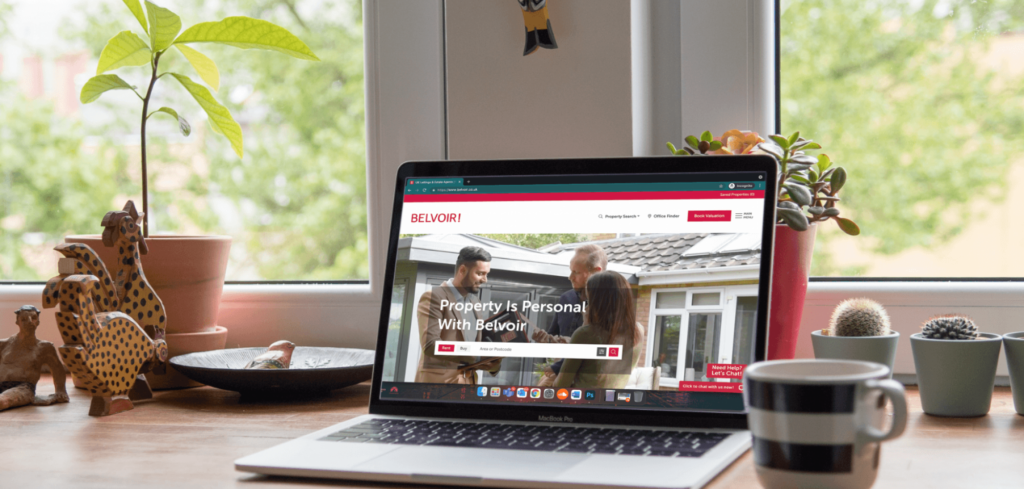 A laptop with the Belvoir Website open on it