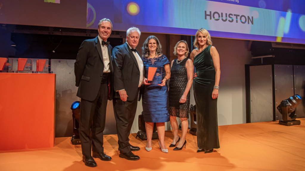 The Belvoir Group team accepting the Best Investor Communication Award at the AIM Awards 2023